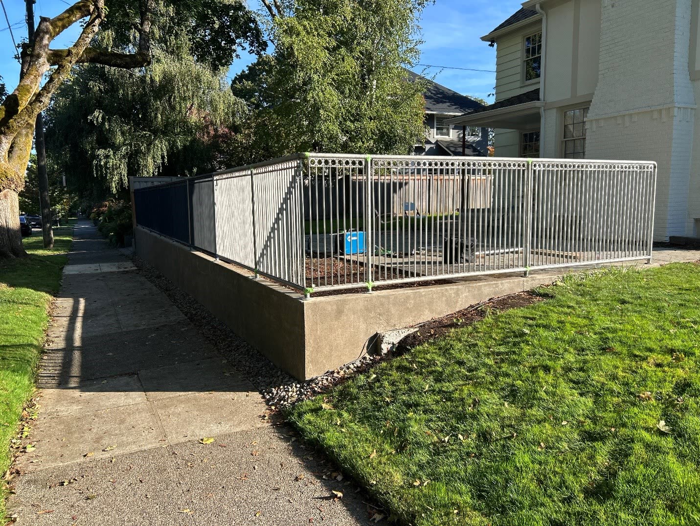 Custom steel fence and railing around a garden