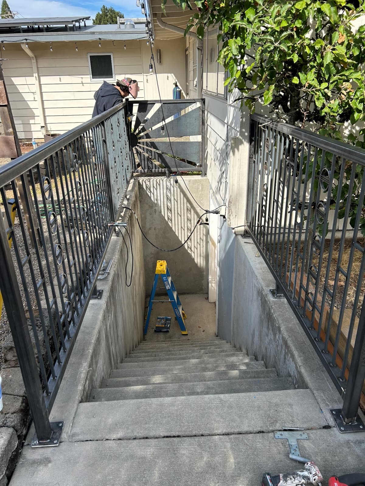 Steel stair railings installed down an exterior stairwell