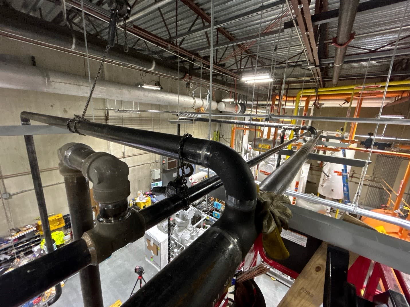 Overhead pipe runs installed in an industrial building